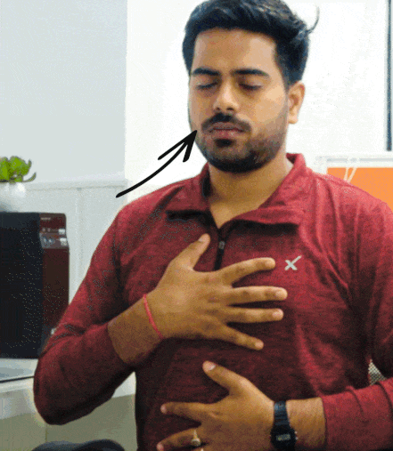 Boy is inhaling during Sama Vritti Pranayama Yoga