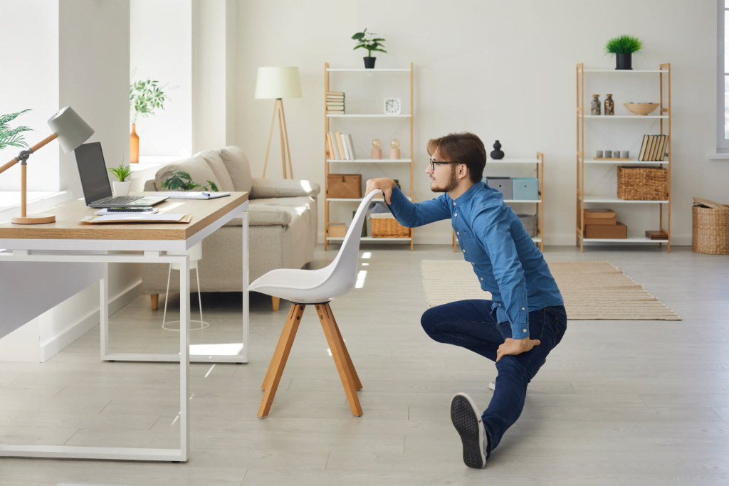 A person is stretching at work