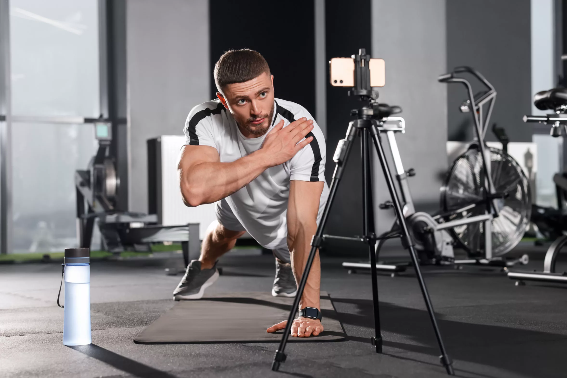 boy is filming himself doing exercise