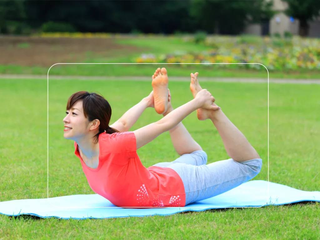 Girl is doing Bow pose yoga