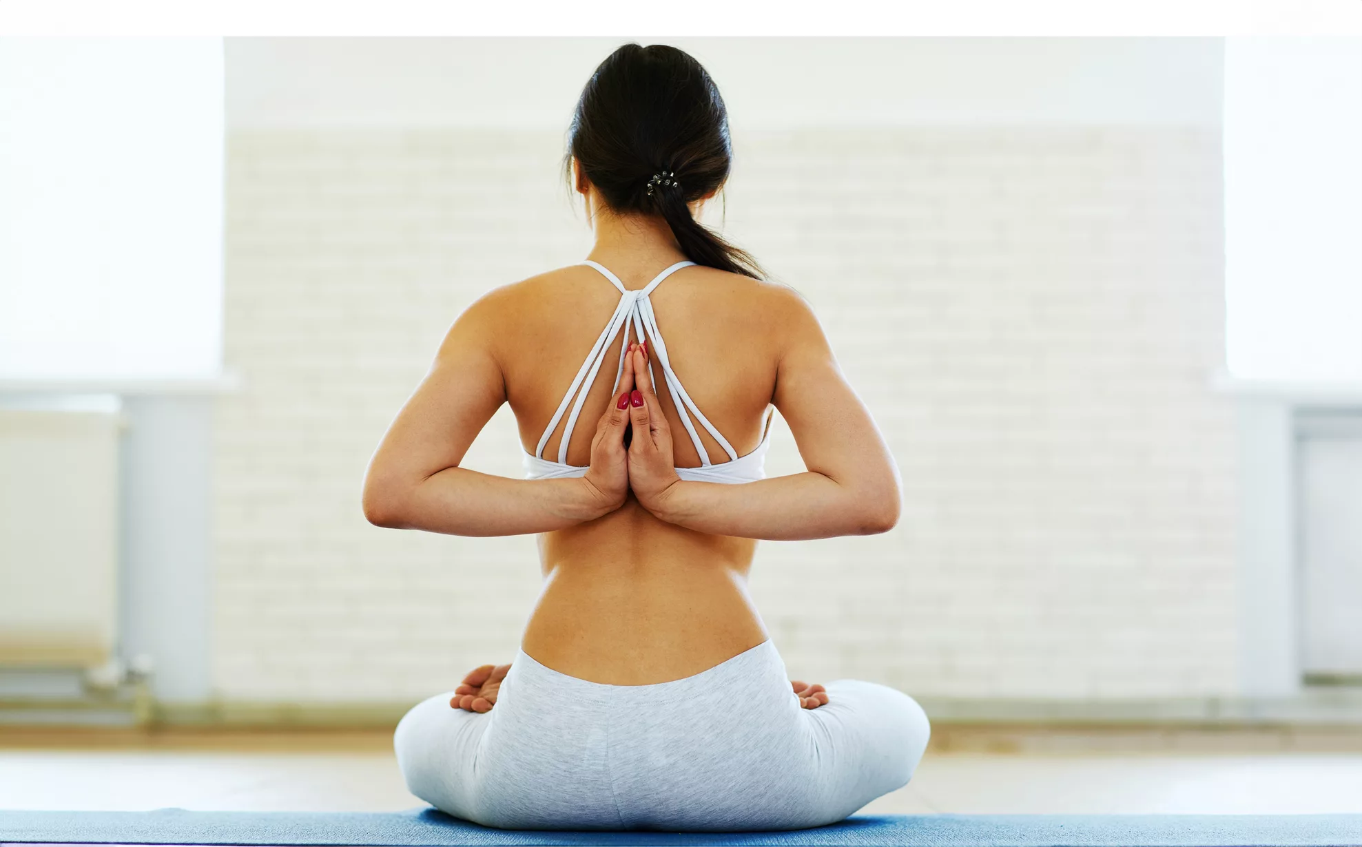 Woman With Closed Eyes Sitting In Prayer Pose. Female Practicing Yoga With  Folded Hands. Stock Photo, Picture and Royalty Free Image. Image 205433502.