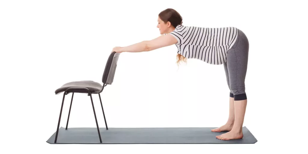 women doing chair stretch during pregnancy