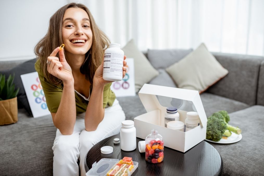 Person holding supplement for better work and intense workout